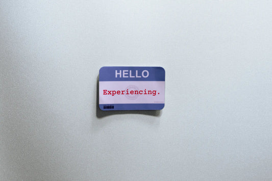 Nametag Sticker — “HELLO — Experiencing” — 3×2 in Waterproof Vinyl