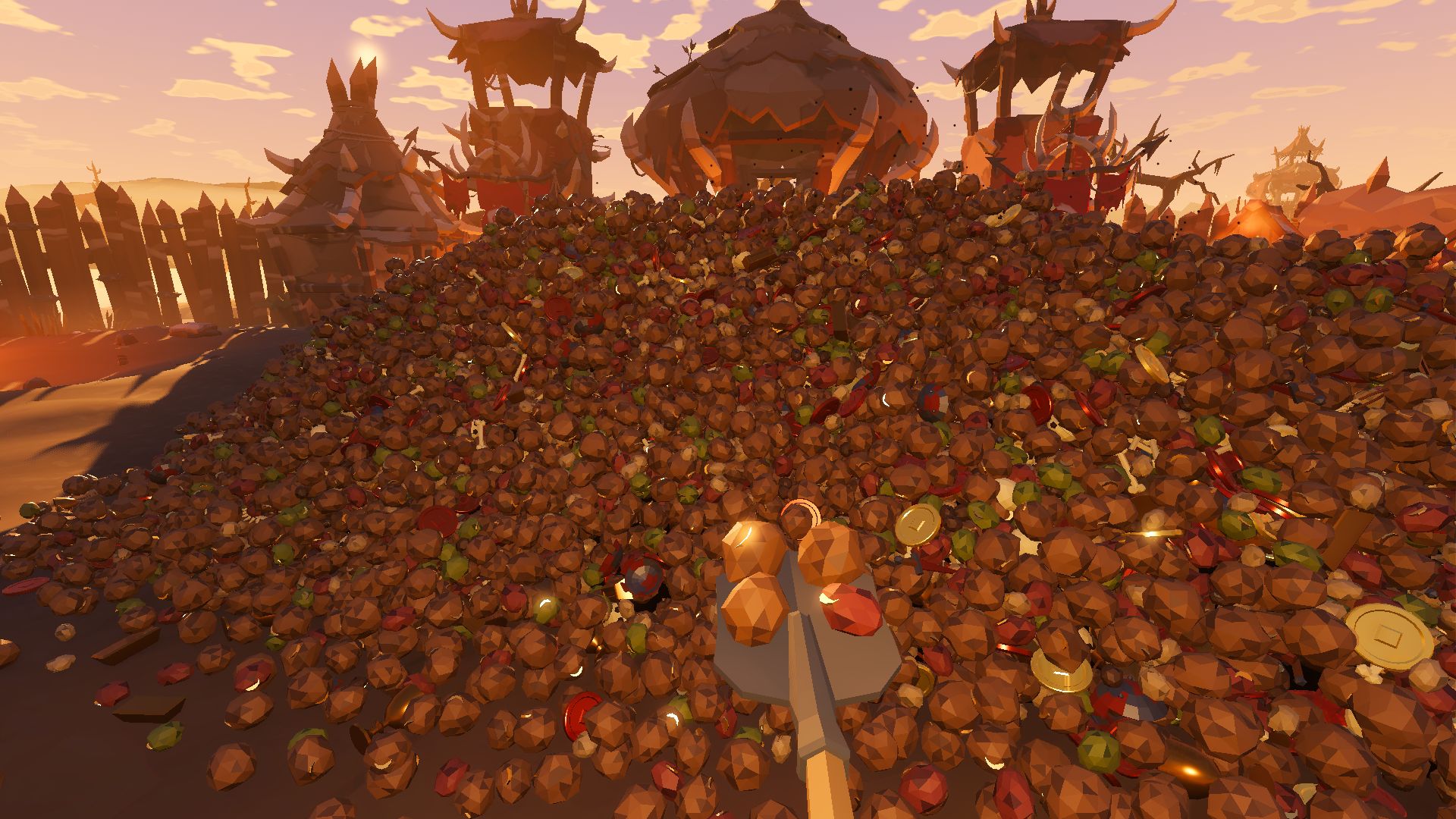 First-person view of a shovel lifting a load of goblin droppings and a red gem off the foot of the heap, with the goblin camp's watchtowers and tent behind it at golden hour.